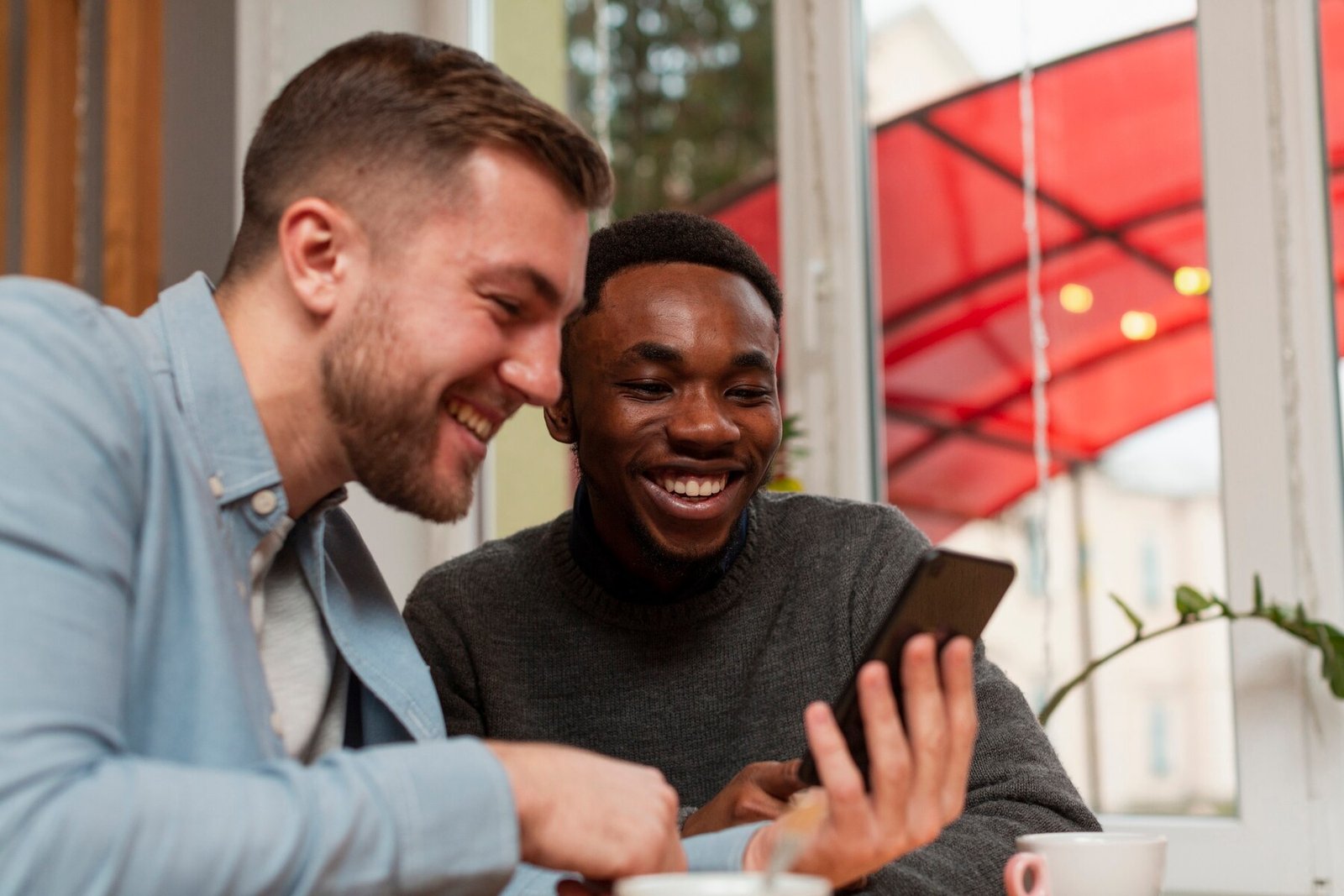 side-view-males-checking-phone_23-2148395326